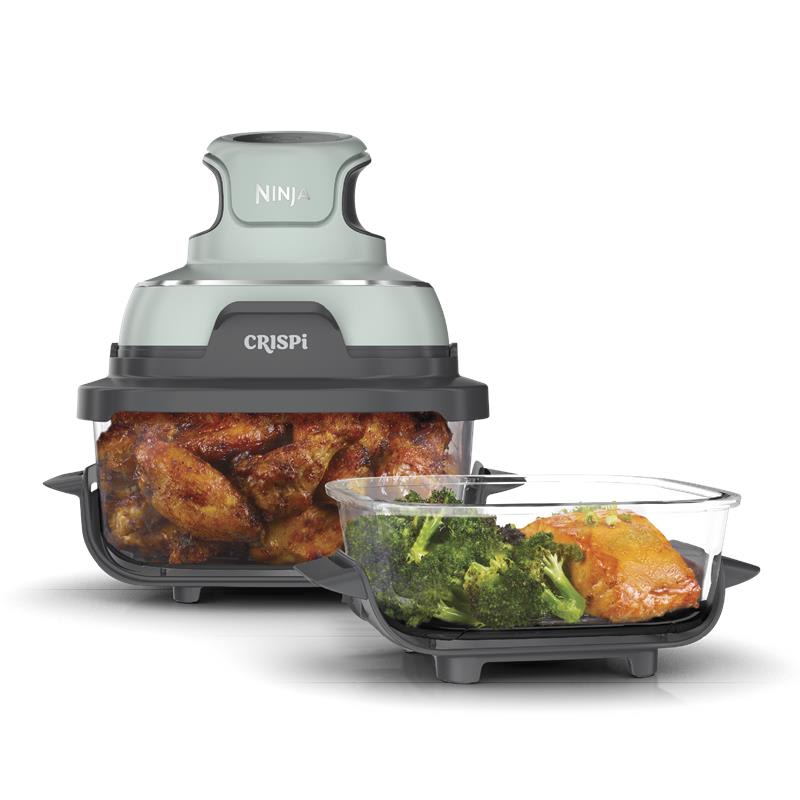Ninja Crispi FN101SG Sage Green PowerPod positioned over a clear glass cooking vessel with a second included vessel visible