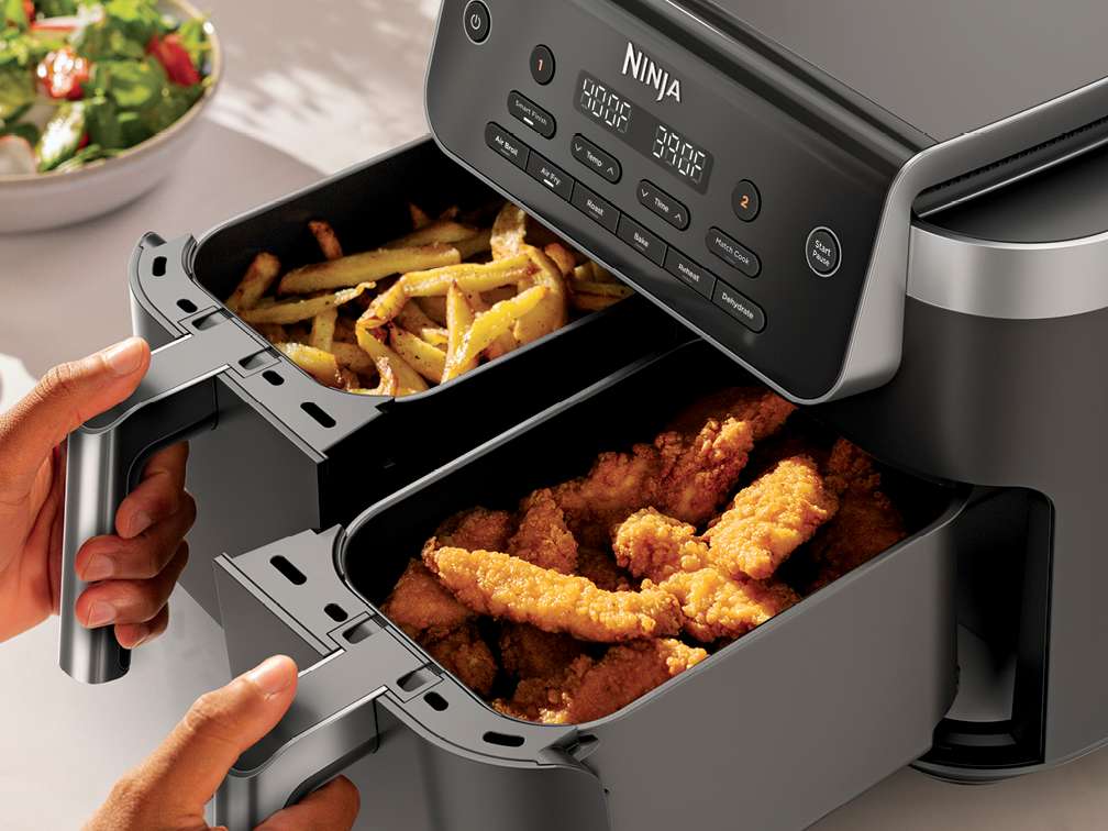 Ninja DZ801 grey two-basket air fryer shown with one drawer open and the digital front control panel